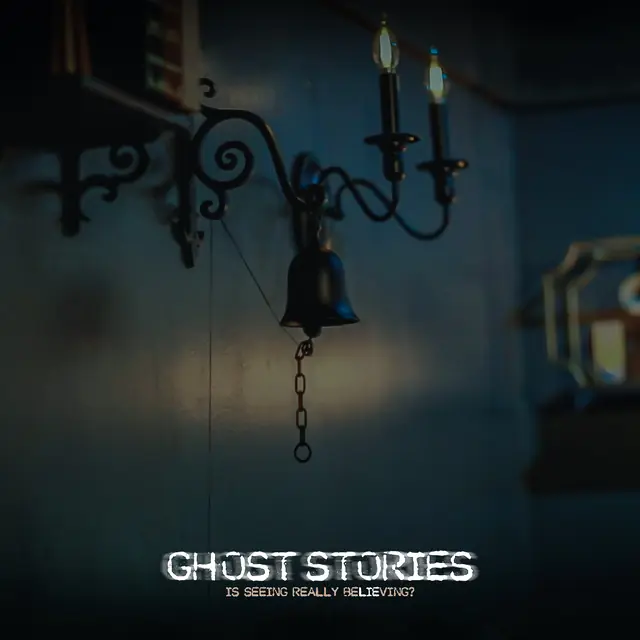 A séance bell hanging from a candle sconce inside the 1923 Prohibition Bar speakeasy